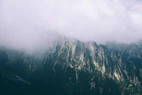 landscape of top of the mountains covered with clouds