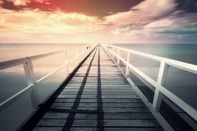 seascape of empty pier at sunset