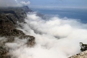 white clouds between the rocks