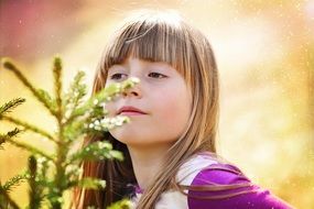 girl and Christmas tree branches