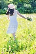 happy girl with wildflowers