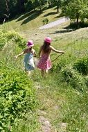 happy children running in the meadow