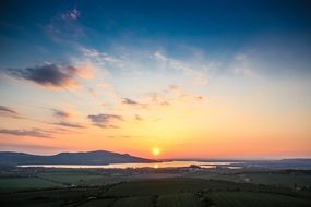 tranquil sunset landscape with colorful sky