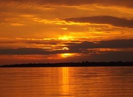 golden sunset over a deep lake