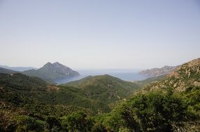 view with green mountains and sea