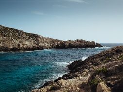 rocky coast of turquoise ocean