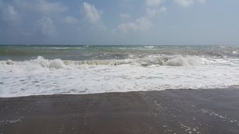 white sea foam on the coast