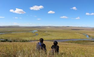 landscape of couple admiring the prairie