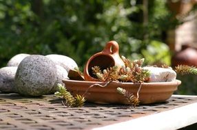 ceramics and stones on a garden table