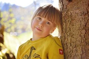nice girl blond near tree