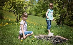 two girls making fireplace