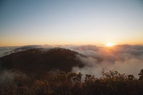 thick fog over the tops of the hills