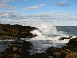 ocean splashes off the rocky coast
