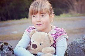 smiling girl with teddy bear
