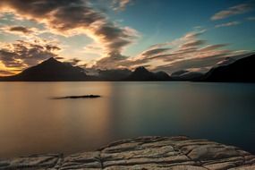 mountains beyond the lake at dusk