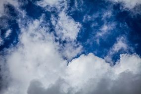 photo of large white clouds in the blue sky