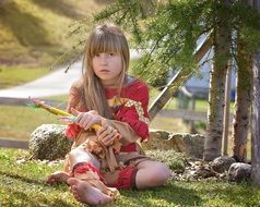 Little girl playing in indians