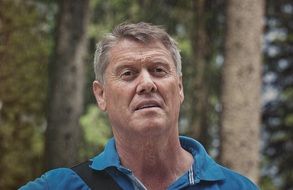 caucasian man in forest close portrait