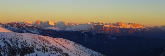 bright sunset in the snowy mountains of south tyrol