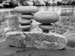 monochrome picture of balance of stones on the shore