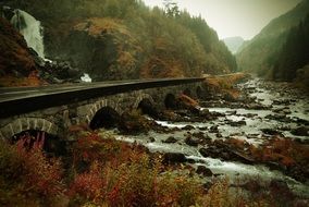 waterfall and stone bridge in Norway