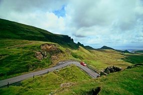 road among green hills