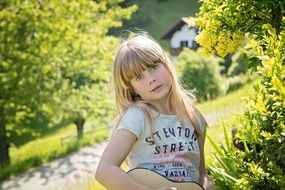girl in nature with guitar