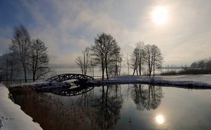 landscape of peaceful winter evening in a park