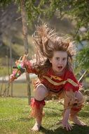 Child in an Indian suit playing in the park