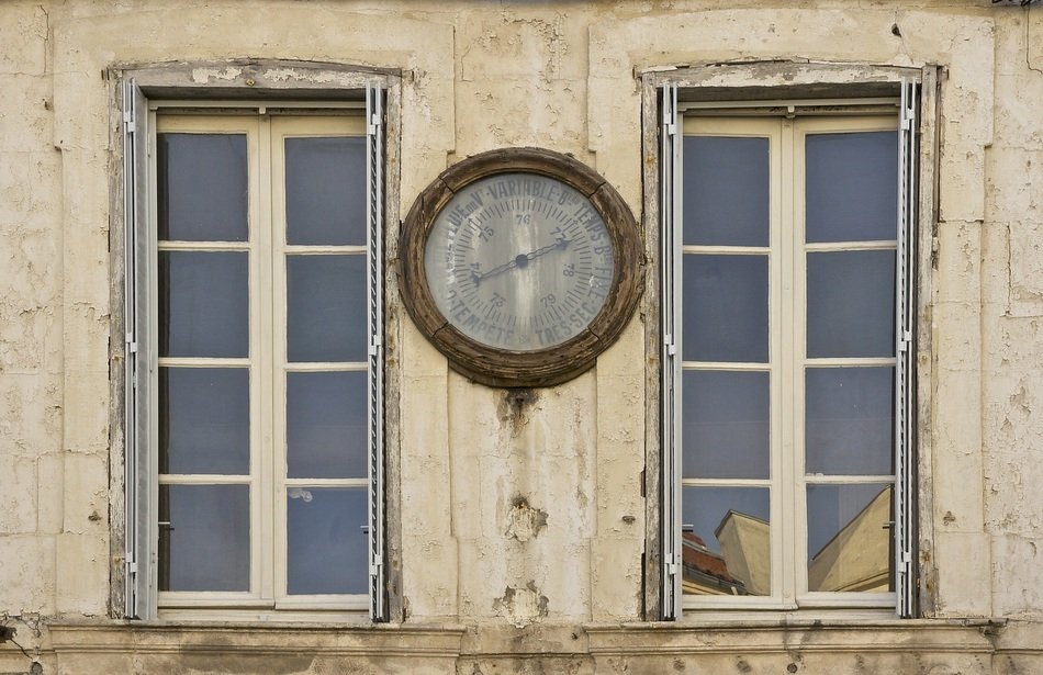 barometer on the facade of an historical building