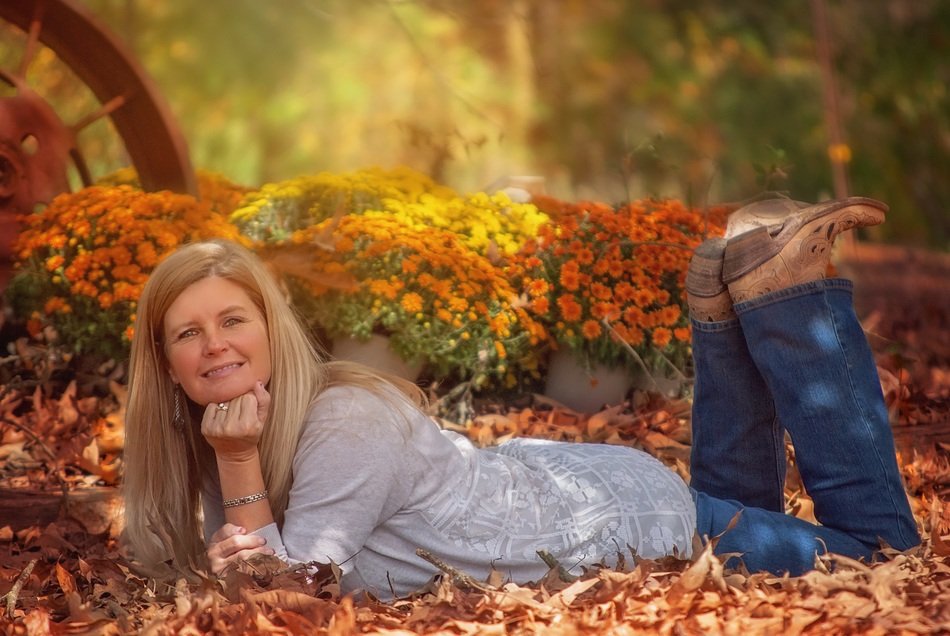girl lies on yellow leaves