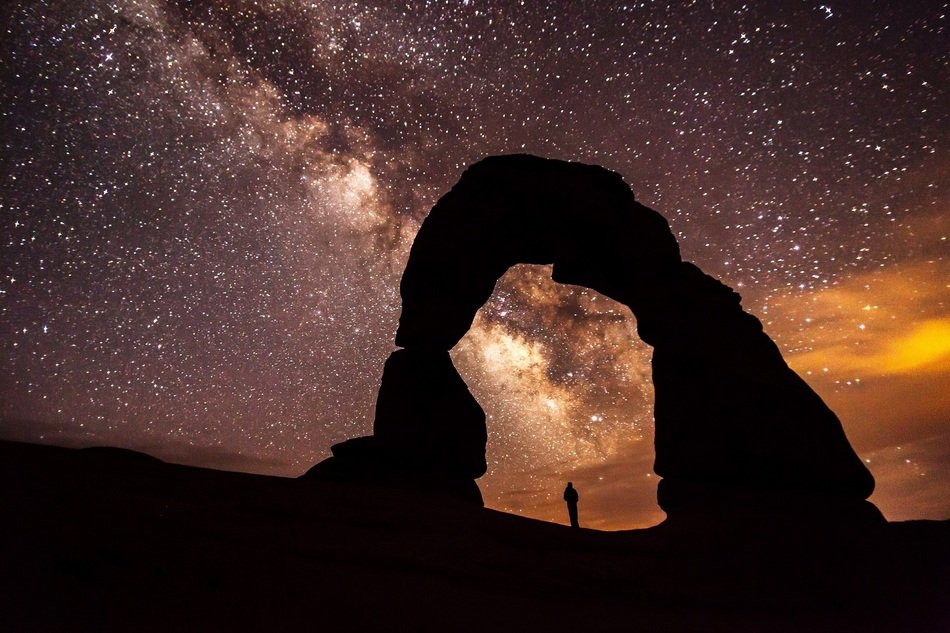 rocky arch on the background of the milky way