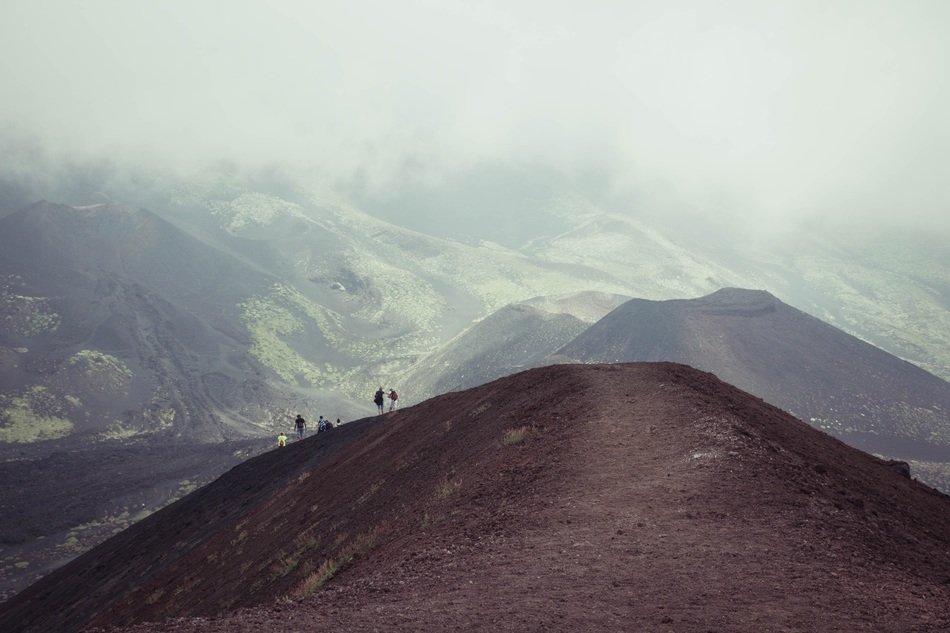 People on a hill in the background of picturesque nature