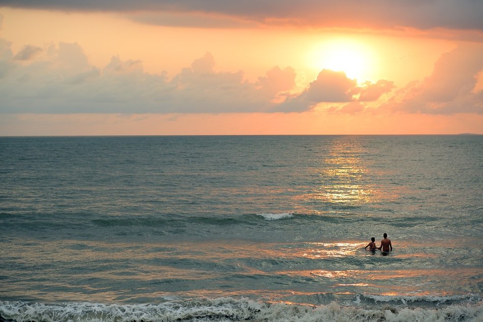tourists swimming in the ocean