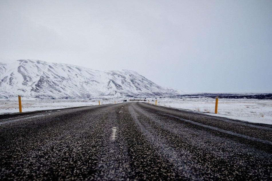 long road made of asphalt in winter