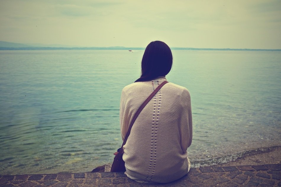 lonely girl on the ocean