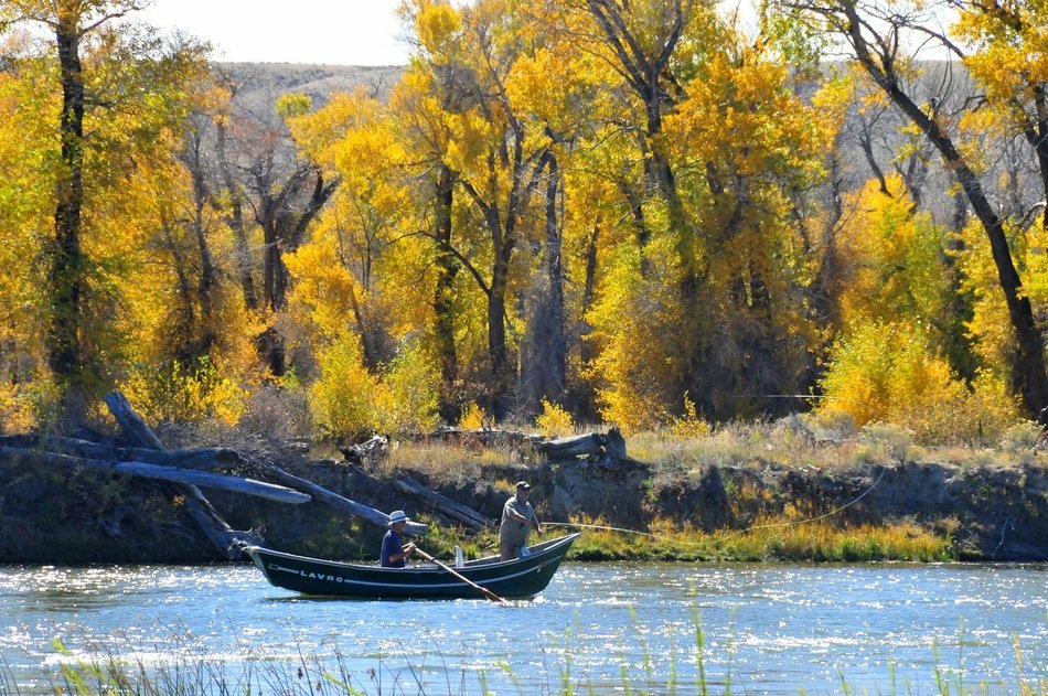 fishing boat in thriver in autumn