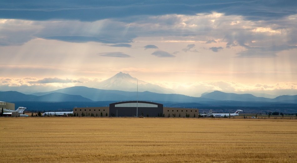 airport building on a background of blue mountains