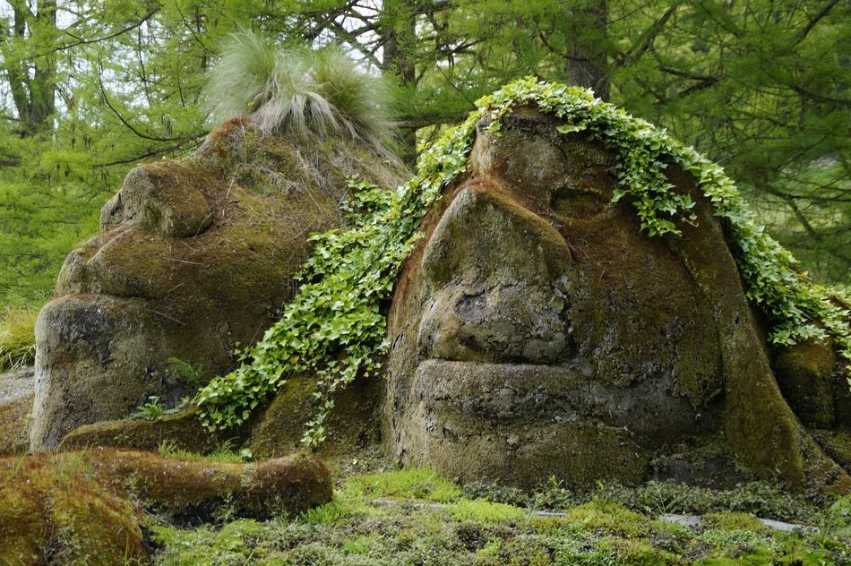 Beautiful stone gnomes in green moss on Mainau Island
