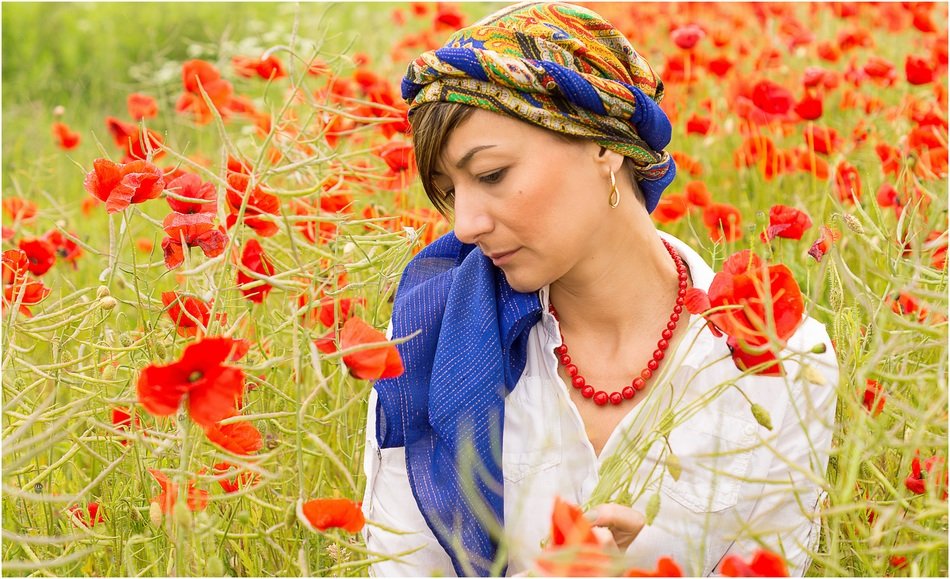 woman in the red poppy field
