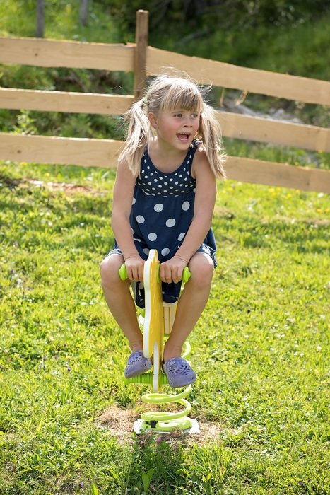 Child in motion on nature