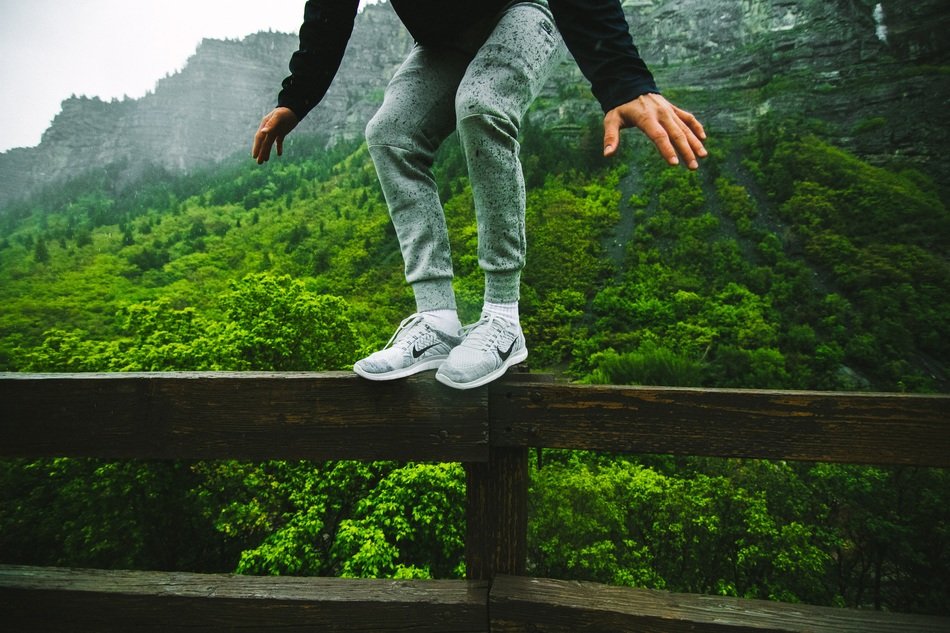jumping off the railing in the forest