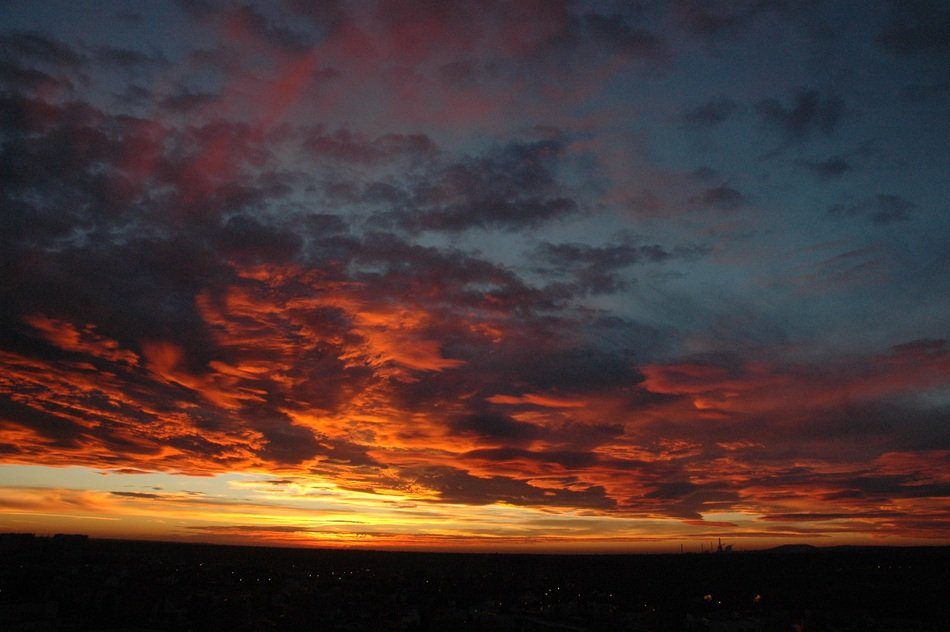 Beautiful and colorful Sun covered with the clouds on landscape