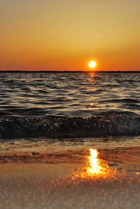 sunny track on the water at sunset