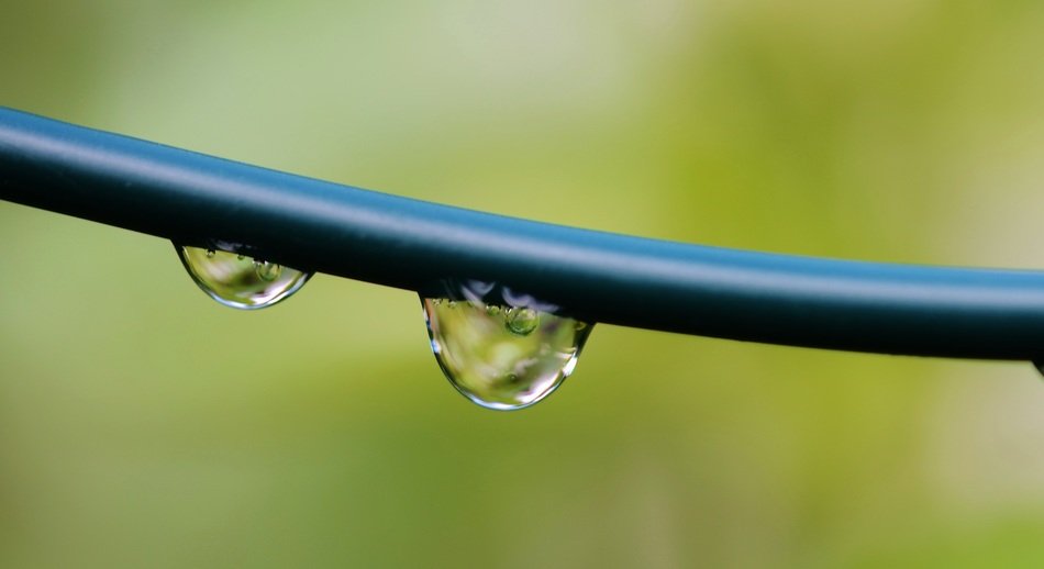 Close-up of the water drops on the metal