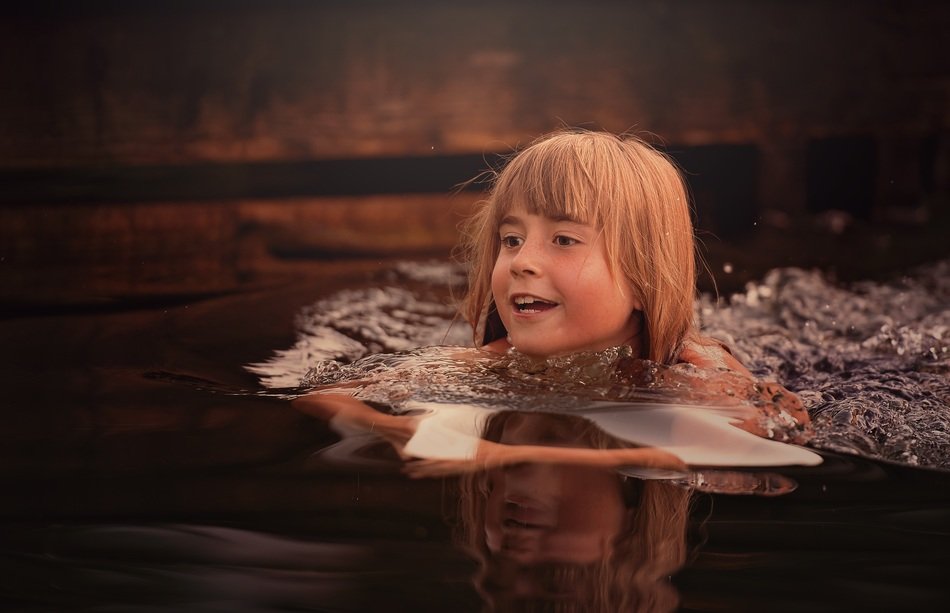 Girl swimming in a river