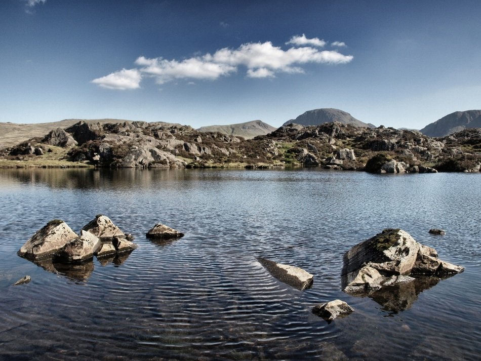 Stones in the lake near the mountains