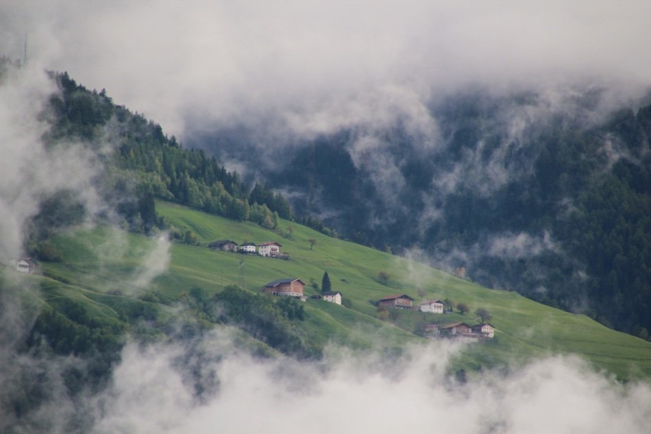 fog over mountain village in South Tyrol