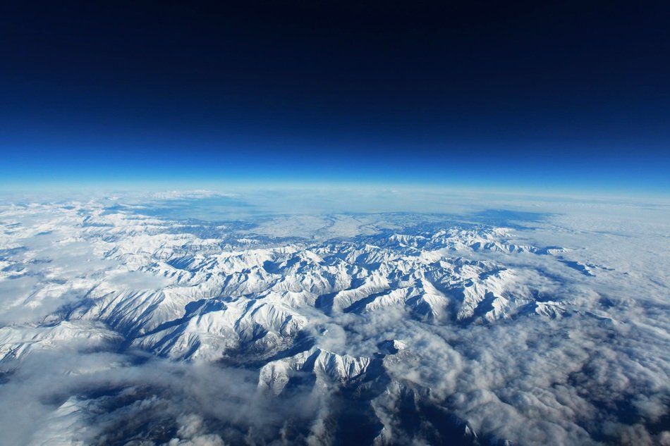 snowy mountains view from space