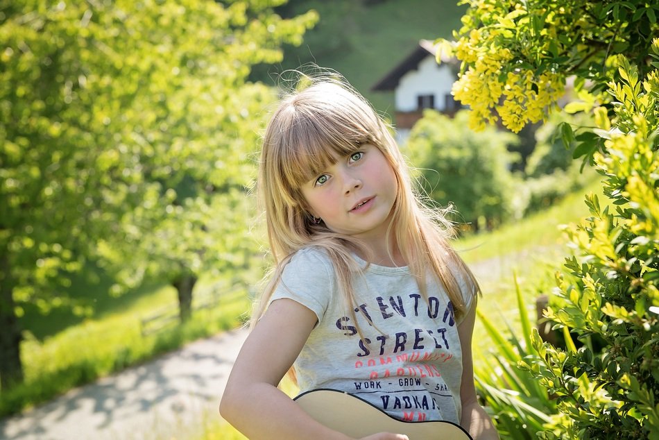girl in nature with guitar